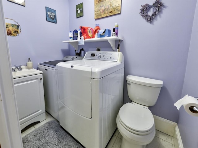 27 Newton Ave, Lynn, MA 01905 - laundry room featuring separate washer and dryer and light marble finish flooring