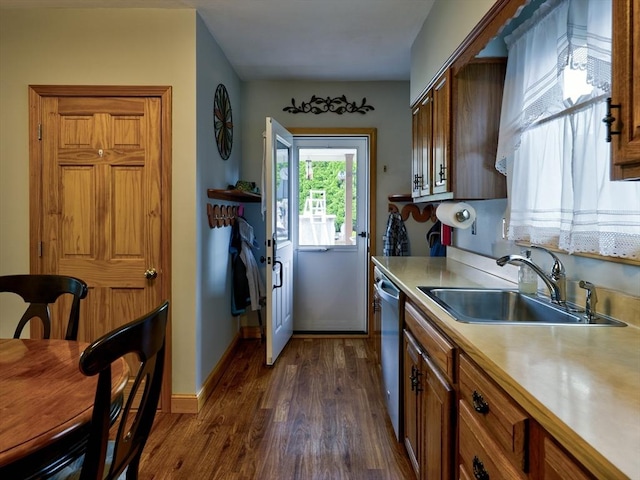 27 Newton Ave, Lynn, MA 01905 - kitchen featuring light countertops, dark wood-style flooring, stainless steel dishwasher, and brown cabinets