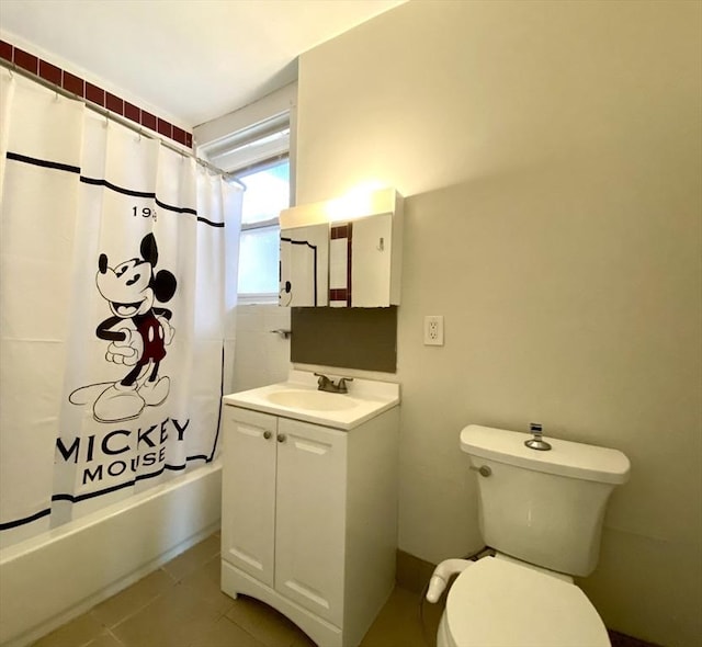 full bathroom featuring vanity, shower / tub combo with curtain, tile patterned floors, and toilet