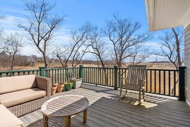 wooden deck with an outdoor living space