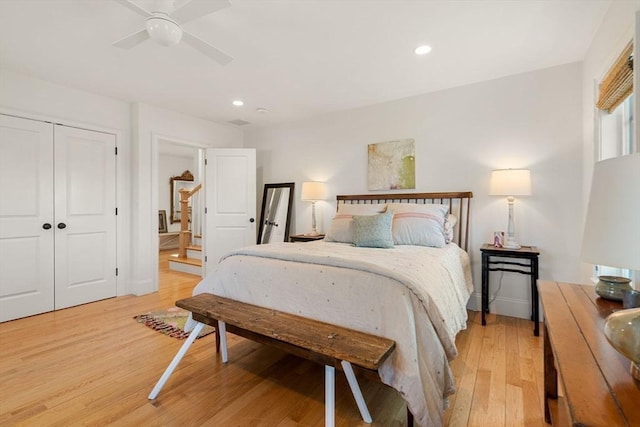 bedroom featuring recessed lighting, a ceiling fan, light wood-style flooring, and a closet