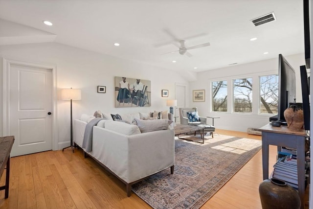 living area featuring recessed lighting, ceiling fan, visible vents, and light wood-style floors