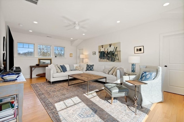 living area with a ceiling fan, recessed lighting, and light wood finished floors