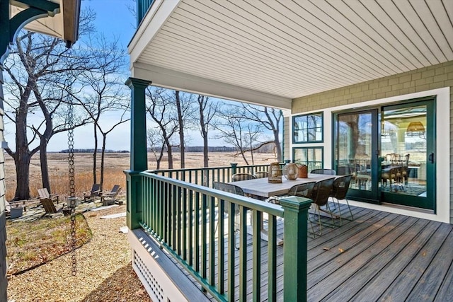 wooden terrace featuring outdoor dining space