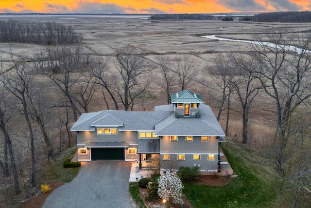 view of front of property featuring a garage and driveway