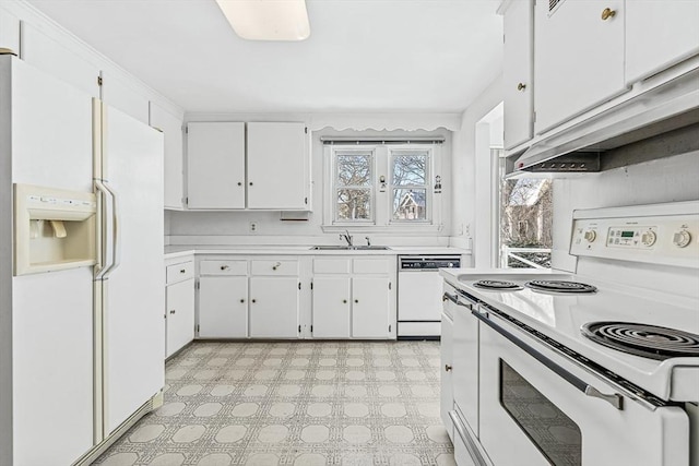 kitchen with white cabinetry, sink, and white appliances