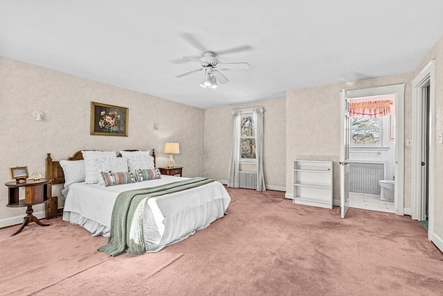 carpeted bedroom with connected bathroom and ceiling fan