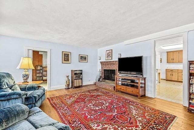 living room featuring a fireplace and hardwood / wood-style floors