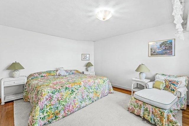 bedroom featuring wood-type flooring