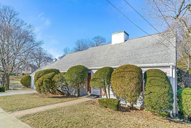 view of side of property with a yard