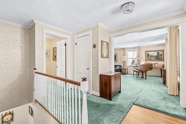 corridor featuring ornamental molding and carpet flooring