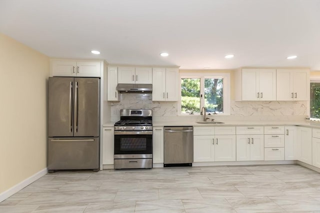 43 Hobart Ter, Braintree, MA 02184 - kitchen with stainless steel appliances, under cabinet range hood, light countertops, decorative backsplash, and recessed lighting