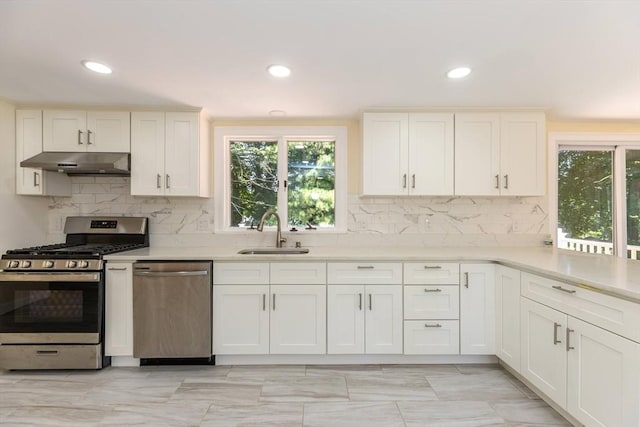 43 Hobart Ter, Braintree, MA 02184 - kitchen featuring stainless steel appliances, under cabinet range hood, light countertops, decorative backsplash, and recessed lighting