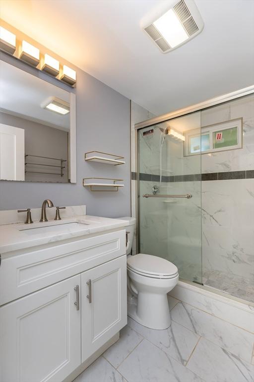43 Hobart Ter, Braintree, MA 02184 - bathroom with marble finish floors, a marble finish shower, and vanity