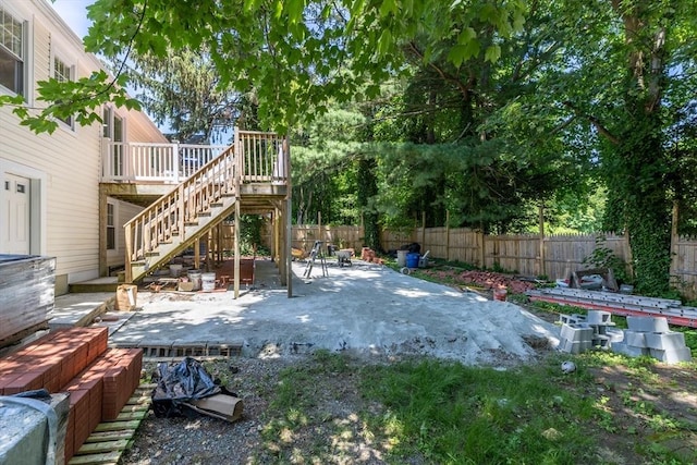 43 Hobart Ter, Braintree, MA 02184 - fenced backyard featuring stairs, a deck, and a patio area