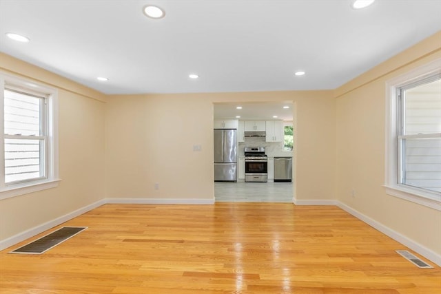 43 Hobart Ter, Braintree, MA 02184 - unfurnished living room with light wood-style flooring and recessed lighting