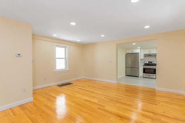 43 Hobart Ter, Braintree, MA 02184 - unfurnished living room with light wood-type flooring and recessed lighting