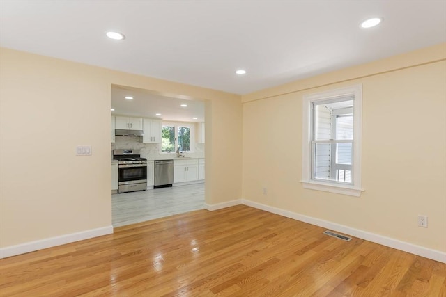 43 Hobart Ter, Braintree, MA 02184 - unfurnished living room with light wood-type flooring and recessed lighting