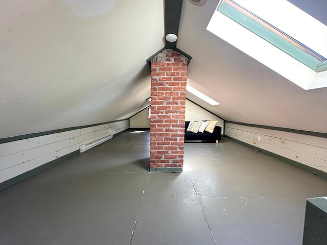 bonus room with vaulted ceiling with skylight and wooden walls