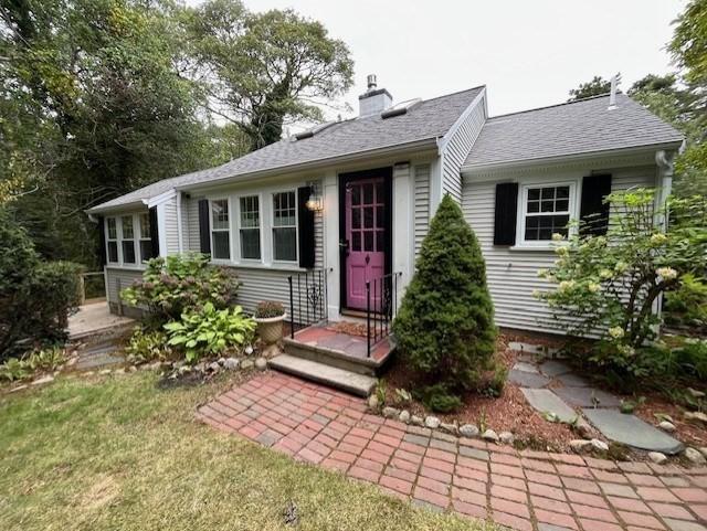 ranch-style house featuring a chimney