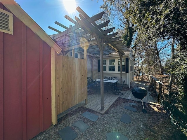 view of home's exterior with a pergola, a patio, and fence