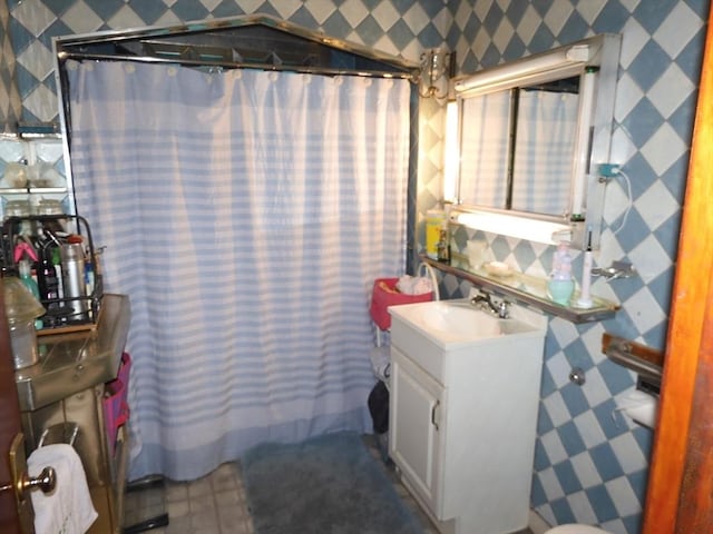 bathroom with vanity and curtained shower