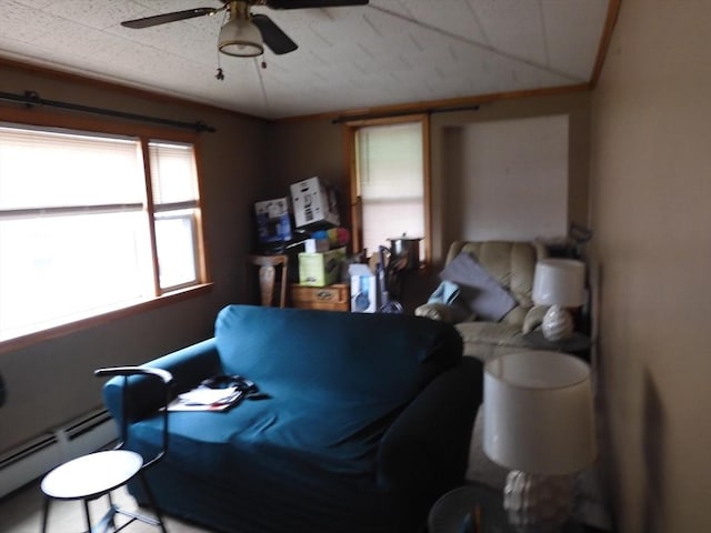 bedroom with a baseboard radiator and ceiling fan