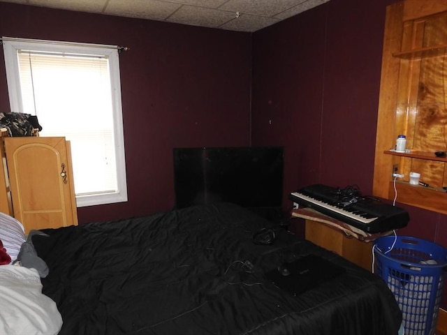bedroom with a drop ceiling