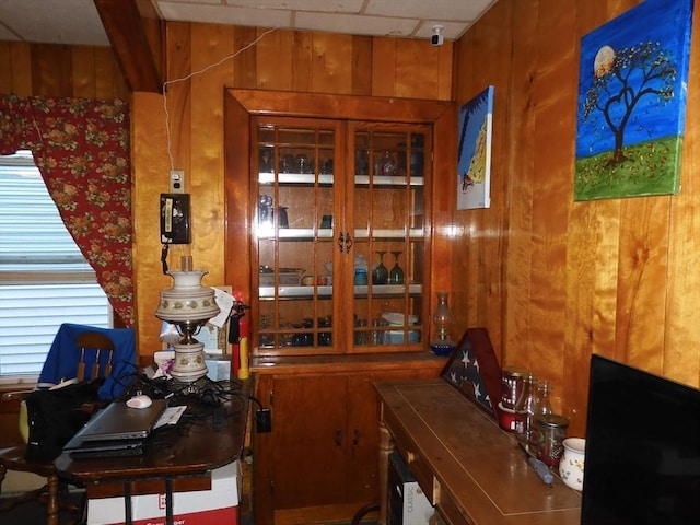 office area with wood walls