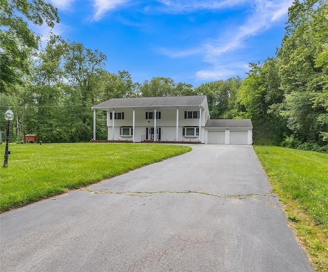 37 Colonial Way, Rehoboth, MA 02769 - view of front of property with a front lawn, a porch, and asphalt driveway