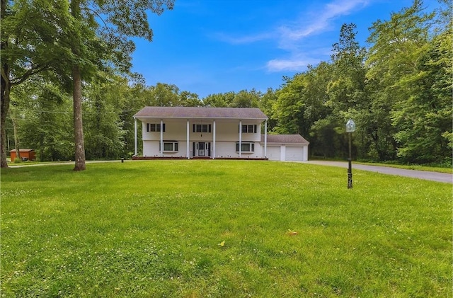 37 Colonial Way, Rehoboth, MA 02769 - view of front of property with a porch, a front yard, and driveway