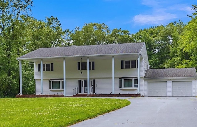 37 Colonial Way, Rehoboth, MA 02769 - view of front of property featuring an attached garage, a front yard, driveway, roof with shingles, and a porch