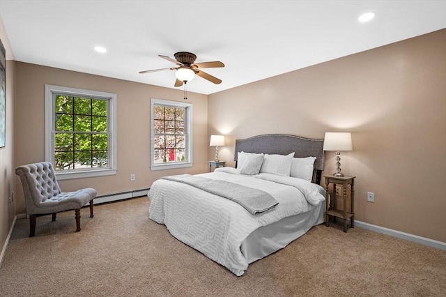 carpeted bedroom featuring baseboard heating, baseboards, recessed lighting, and ceiling fan