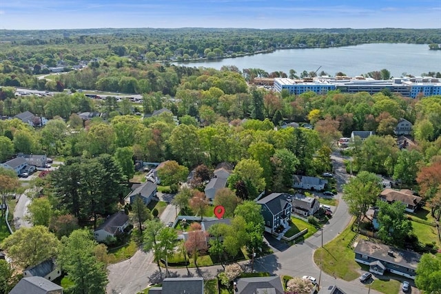 aerial view of a large body of water and a heavily wooded area