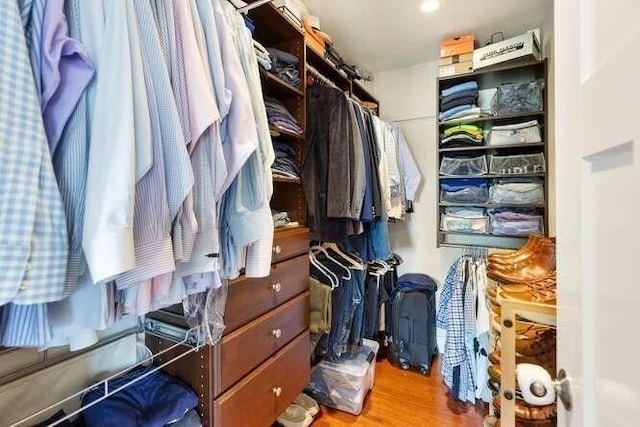 spacious closet featuring wood finished floors