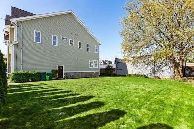 back of house featuring a yard