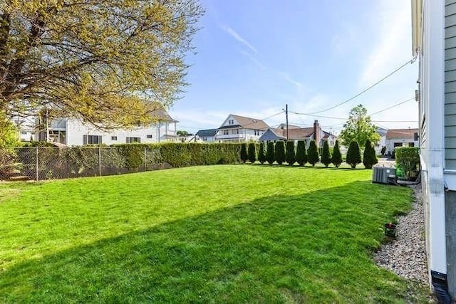 view of yard featuring central AC unit
