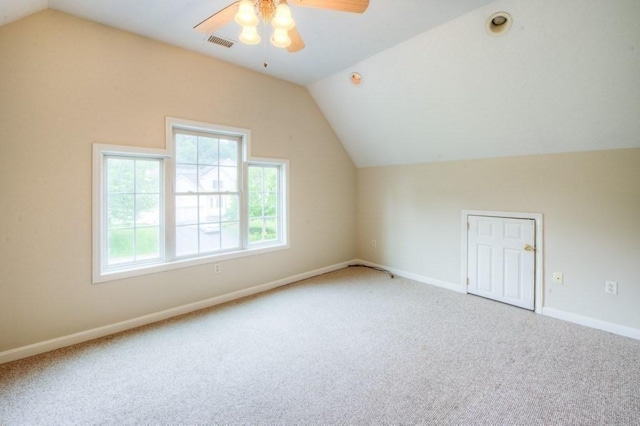 additional living space with vaulted ceiling, ceiling fan, and carpet flooring