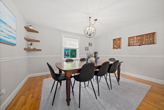 10 Stoughton Rd, Dedham, MA 02026 - dining space featuring a chandelier, wood finished floors, and baseboards
