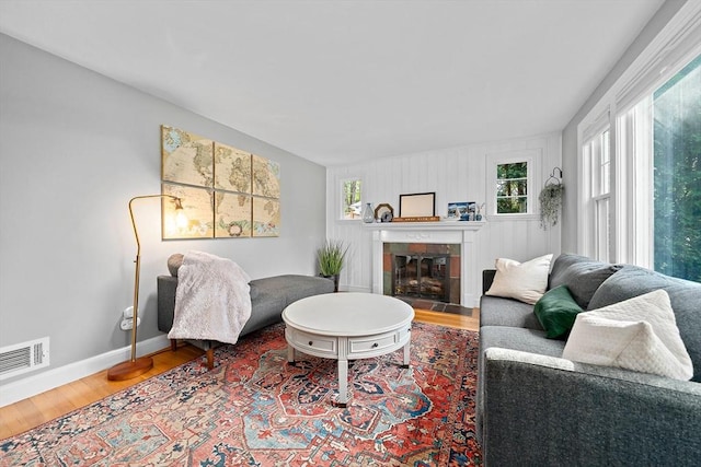 10 Stoughton Rd, Dedham, MA 02026 - living room featuring wood finished floors, baseboards, and a fireplace