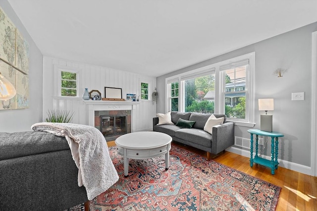 10 Stoughton Rd, Dedham, MA 02026 - living area featuring wood finished floors, baseboards, and a fireplace