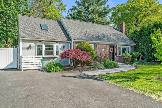 10 Stoughton Rd, Dedham, MA 02026 - cape cod home with a shingled roof, a chimney, and brick siding