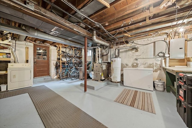 10 Stoughton Rd, Dedham, MA 02026 - unfinished below grade area with gas water heater, electric panel, fridge, washing machine and clothes dryer, and heating unit