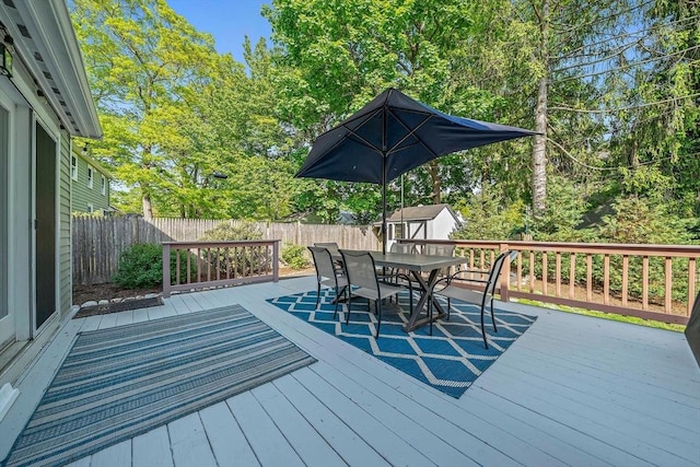 10 Stoughton Rd, Dedham, MA 02026 - wooden terrace featuring outdoor dining area and a fenced backyard
