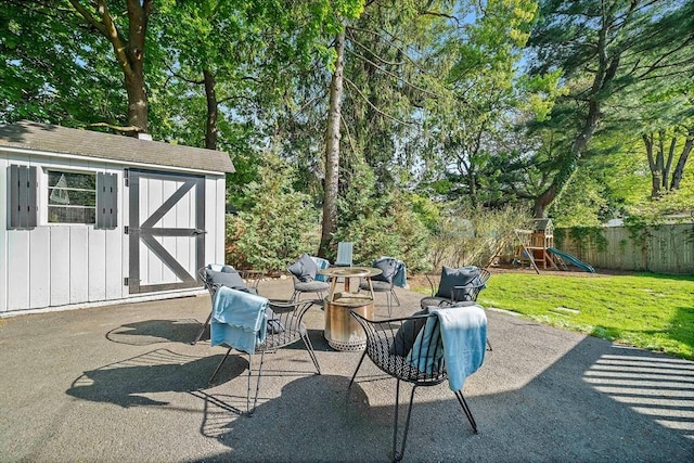 10 Stoughton Rd, Dedham, MA 02026 - view of patio featuring a playground and view of wooded area