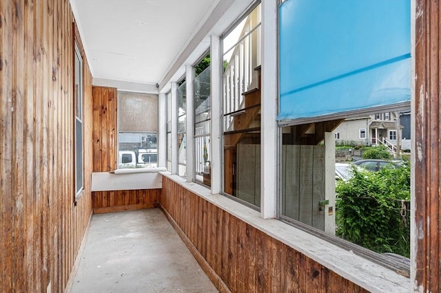 34 May St, Lowell, MA 01850 - unfurnished sunroom with concrete flooring and wood walls