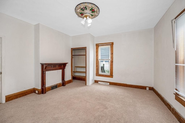 34 May St, Lowell, MA 01850 - carpeted empty room with baseboards