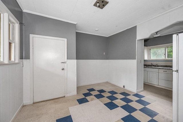 34 May St, Lowell, MA 01850 - empty room with ornamental molding, light flooring, and wainscoting