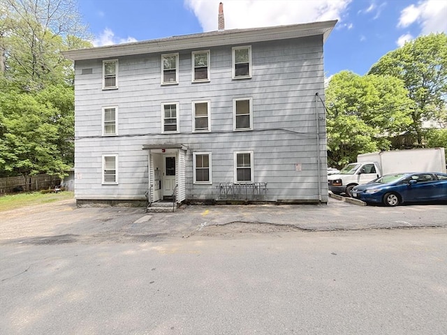 view of front of home featuring a chimney