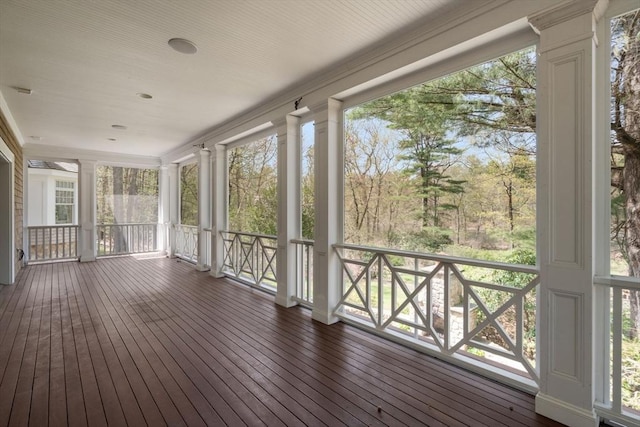 unfurnished sunroom featuring a wealth of natural light